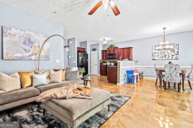 3832 Augustine Pl, Rex, GA 30273 - living room with a ceiling fan and a textured ceiling