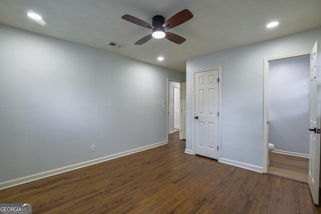 7144 Carolyn Cir, Lithia Springs, GA 30122 - unfurnished bedroom with dark wood-type flooring, recessed lighting, ensuite bathroom, and a ceiling fan