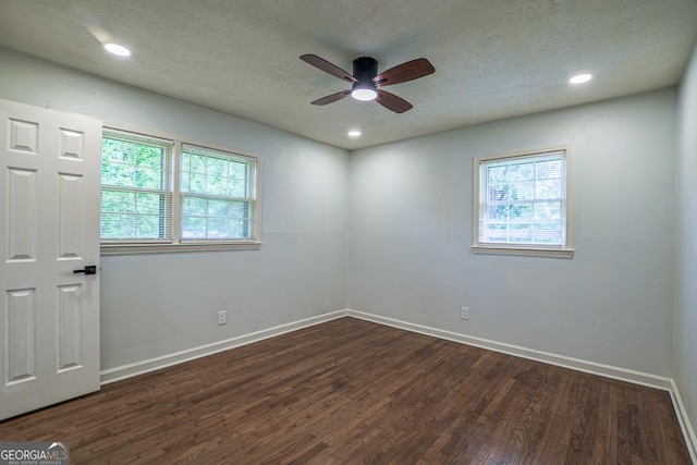 7144 Carolyn Cir, Lithia Springs, GA 30122 - empty room with dark wood-type flooring, ceiling fan, a textured ceiling, and recessed lighting
