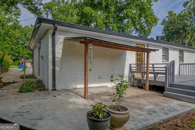 7144 Carolyn Cir, Lithia Springs, GA 30122 - exterior space featuring brick siding and a patio area