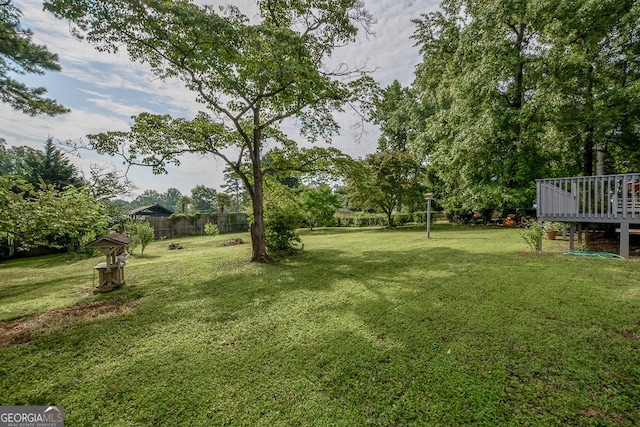 7144 Carolyn Cir, Lithia Springs, GA 30122 - view of green lawn with a deck