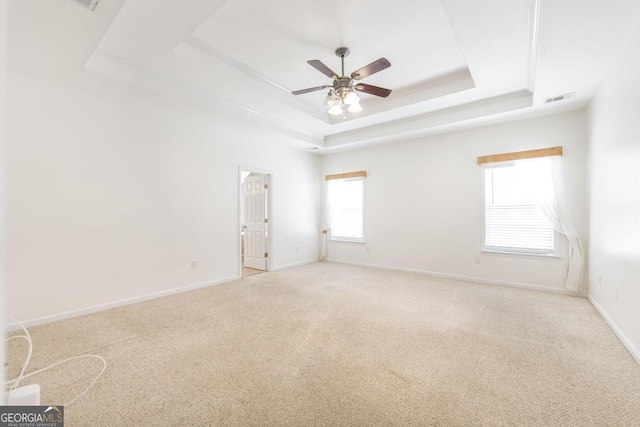 132 Hidden Creek Cir, Lizella, GA 31052 - unfurnished room featuring a tray ceiling, ceiling fan, and light carpet