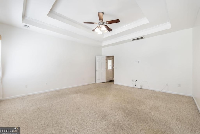 132 Hidden Creek Cir, Lizella, GA 31052 - spare room with a tray ceiling, light carpet, a ceiling fan, and ornamental molding
