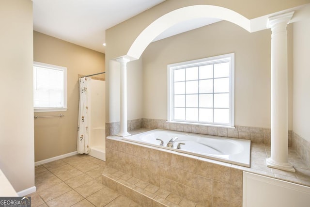 132 Hidden Creek Cir, Lizella, GA 31052 - bathroom with decorative columns, plenty of natural light, a bath, and tile patterned flooring