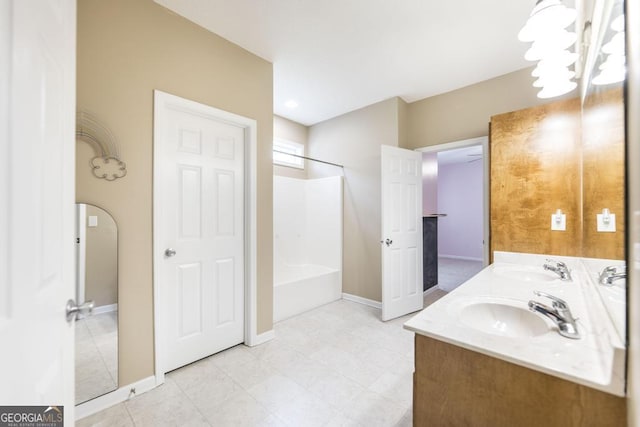 132 Hidden Creek Cir, Lizella, GA 31052 - full bath with double vanity, a chandelier, and shower / tub combination