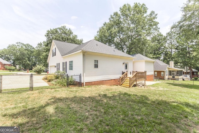132 Hidden Creek Cir, Lizella, GA 31052 - back of property featuring a garage, a wooden deck, a gate, and roof with shingles