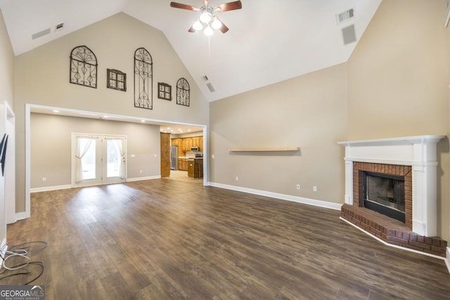 132 Hidden Creek Cir, Lizella, GA 31052 - unfurnished living room with a ceiling fan, high vaulted ceiling, wood finished floors, and a fireplace
