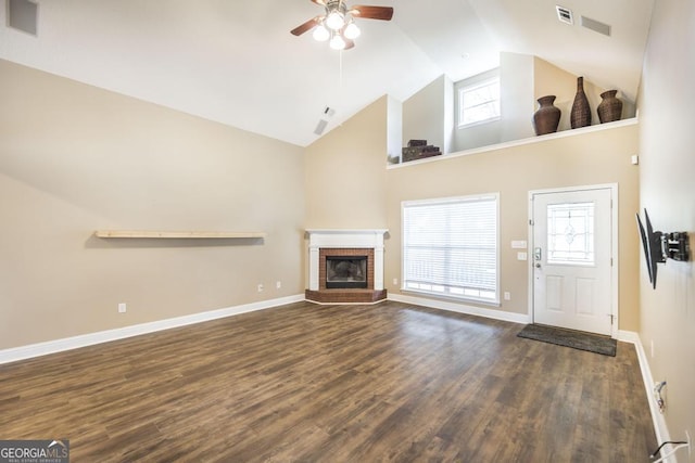 132 Hidden Creek Cir, Lizella, GA 31052 - unfurnished living room featuring a ceiling fan, high vaulted ceiling, wood finished floors, a fireplace, and plenty of natural light