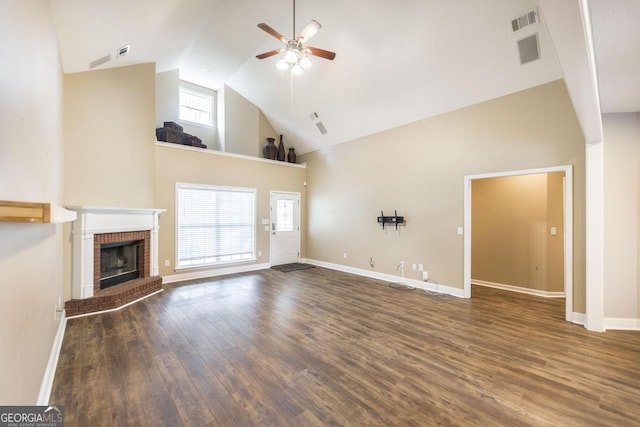 132 Hidden Creek Cir, Lizella, GA 31052 - unfurnished living room with high vaulted ceiling, ceiling fan, a fireplace, and wood finished floors