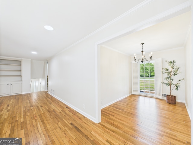 4630 Glenwood Dr, Macon, GA 31210 - unfurnished room with a chandelier, light wood-style flooring, built in features, crown molding, and recessed lighting