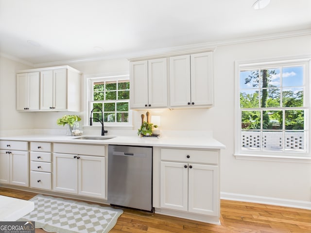 4630 Glenwood Dr, Macon, GA 31210 - kitchen with dishwasher, crown molding, light wood finished floors, light countertops, and white cabinets