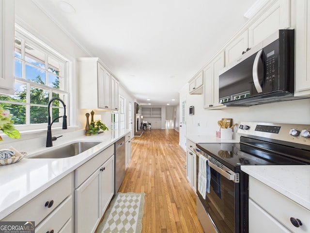 4630 Glenwood Dr, Macon, GA 31210 - kitchen featuring stainless steel appliances, white cabinets, healthy amount of natural light, and recessed lighting
