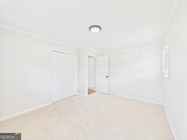 4630 Glenwood Dr, Macon, GA 31210 - unfurnished bedroom featuring ornamental molding, carpet flooring, and a closet