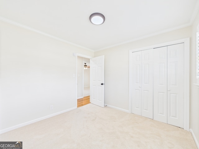 4630 Glenwood Dr, Macon, GA 31210 - unfurnished bedroom with crown molding, carpet floors, and a closet