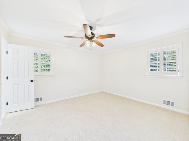4630 Glenwood Dr, Macon, GA 31210 - spare room featuring plenty of natural light, a ceiling fan, ornamental molding, and light colored carpet