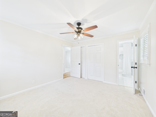4630 Glenwood Dr, Macon, GA 31210 - unfurnished bedroom featuring crown molding, light carpet, connected bathroom, and ceiling fan