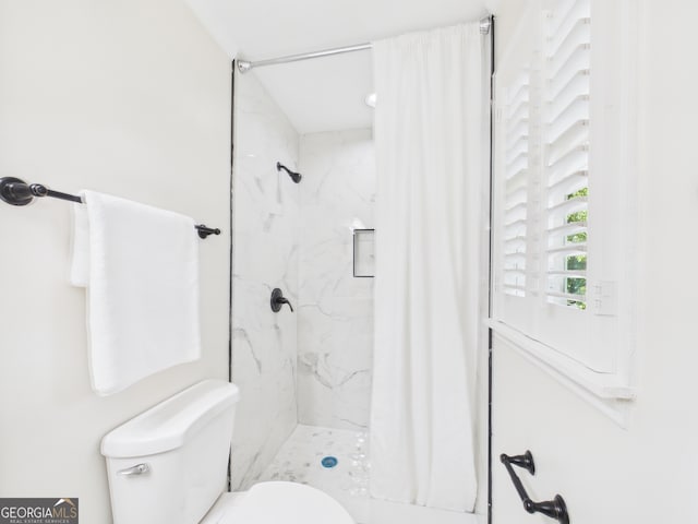 4630 Glenwood Dr, Macon, GA 31210 - bathroom with toilet and a marble finish shower