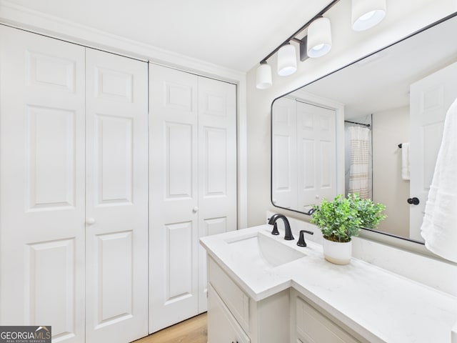 4630 Glenwood Dr, Macon, GA 31210 - full bath with a closet, vanity, and wood finished floors