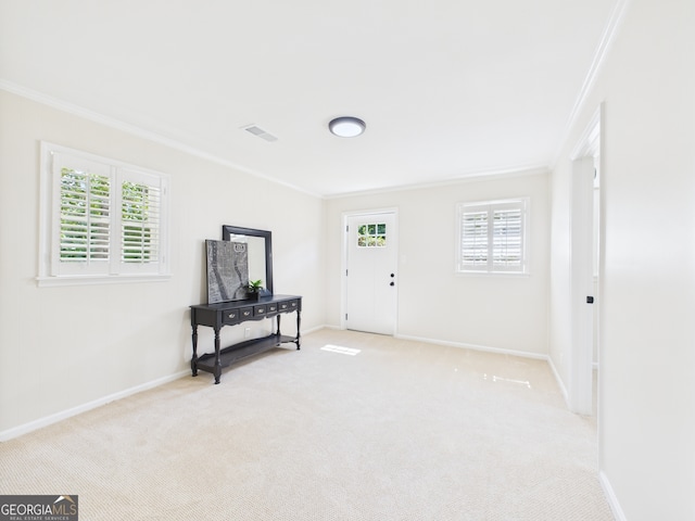 4630 Glenwood Dr, Macon, GA 31210 - carpeted foyer entrance featuring crown molding and plenty of natural light