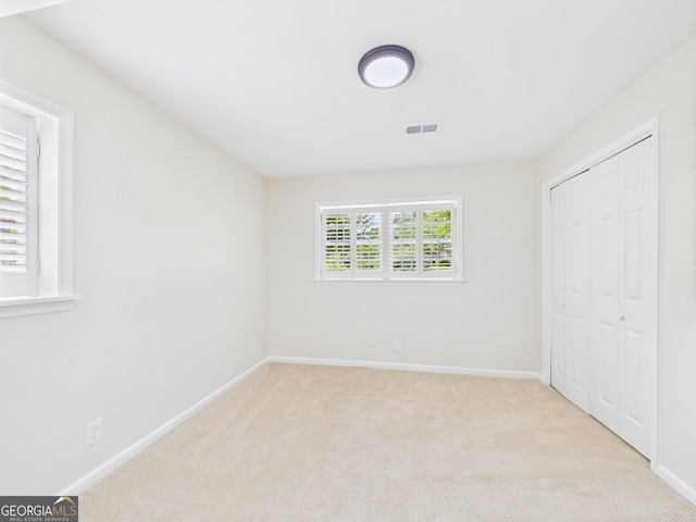 4630 Glenwood Dr, Macon, GA 31210 - unfurnished bedroom with carpet and a closet