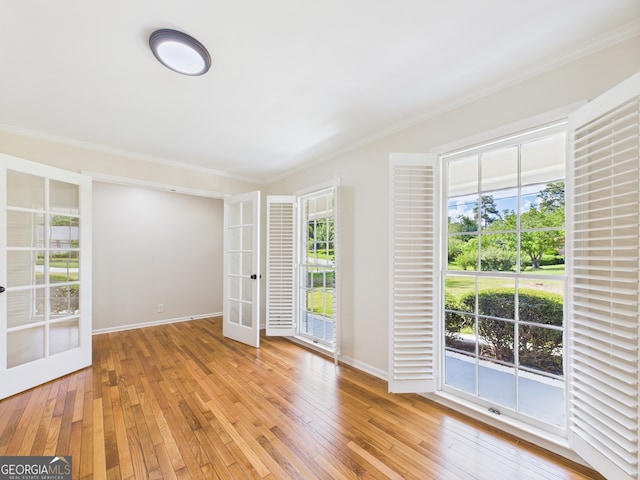 4630 Glenwood Dr, Macon, GA 31210 - spare room with french doors, ornamental molding, and light wood-style floors