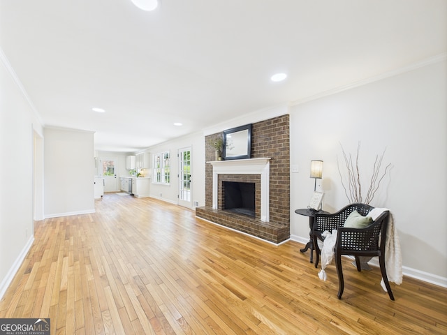 4630 Glenwood Dr, Macon, GA 31210 - living area featuring ornamental molding, light wood finished floors, a fireplace, and recessed lighting