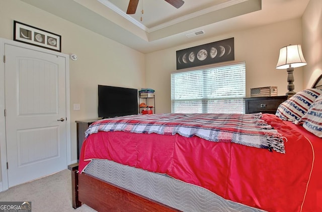 862 Crescent Ln, Griffin, GA 30224 - bedroom featuring carpet flooring, ornamental molding, a tray ceiling, and ceiling fan