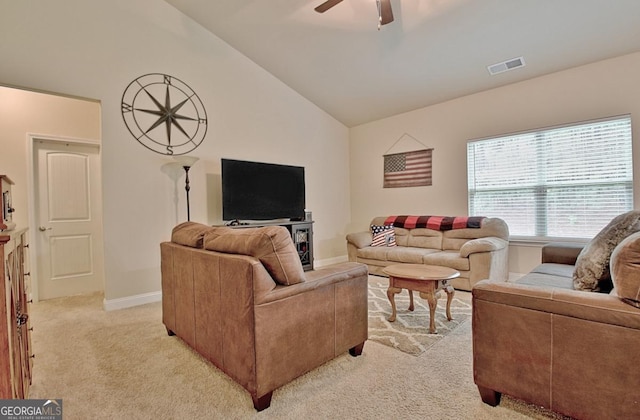 862 Crescent Ln, Griffin, GA 30224 - living room with lofted ceiling, light carpet, and a ceiling fan