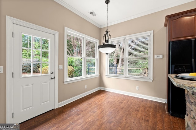1065 Beacon Hill Xing, Alpharetta, GA 30005 - unfurnished dining area featuring crown molding, healthy amount of natural light, and dark wood finished floors