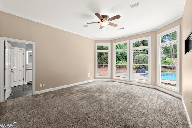 1065 Beacon Hill Xing, Alpharetta, GA 30005 - unfurnished room with dark colored carpet, crown molding, a ceiling fan, and plenty of natural light