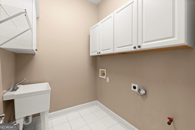 1065 Beacon Hill Xing, Alpharetta, GA 30005 - washroom with cabinet space, washer hookup, electric dryer hookup, and light tile patterned flooring