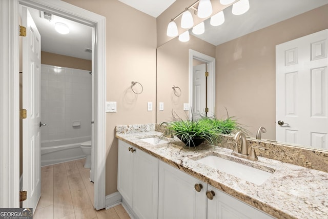 1065 Beacon Hill Xing, Alpharetta, GA 30005 - full bathroom featuring double vanity, bathtub / shower combination, and wood finished floors