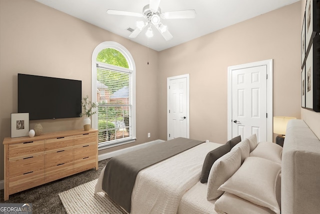 1065 Beacon Hill Xing, Alpharetta, GA 30005 - bedroom featuring dark carpet and a ceiling fan