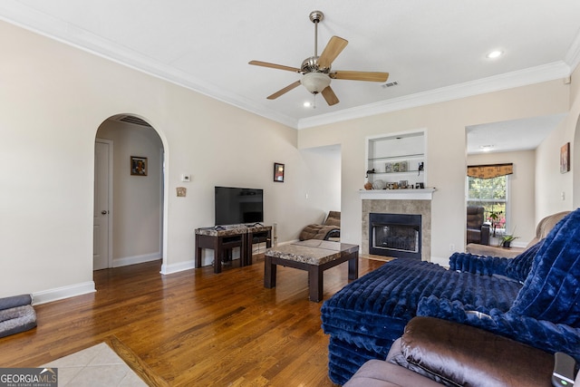 408 Dixieland Dr, Byron, GA 31008 - living room with arched walkways, ceiling fan, a fireplace, ornamental molding, and recessed lighting