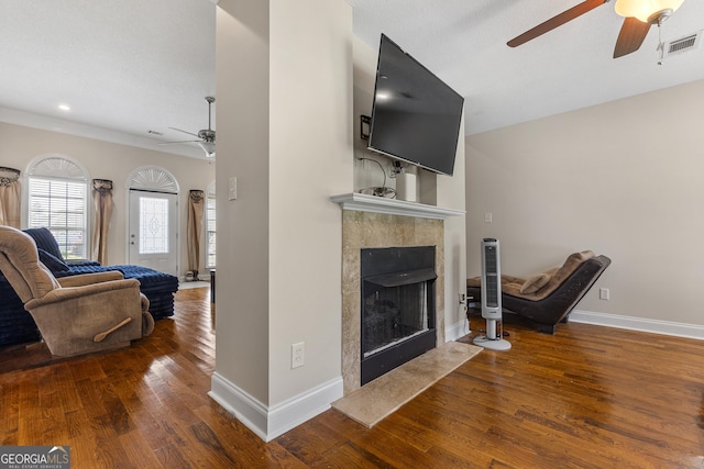 408 Dixieland Dr, Byron, GA 31008 - living room featuring a ceiling fan, wood finished floors, a premium fireplace, and ornamental molding