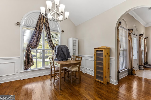 408 Dixieland Dr, Byron, GA 31008 - dining space with arched walkways, plenty of natural light, wood finished floors, a chandelier, and ornamental molding