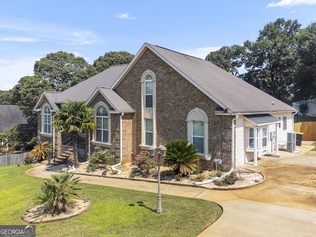 408 Dixieland Dr, Byron, GA 31008 - view of front of property featuring brick siding, a shingled roof, and concrete driveway