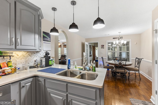 408 Dixieland Dr, Byron, GA 31008 - kitchen featuring gray cabinets, a peninsula, tasteful backsplash, and light countertops