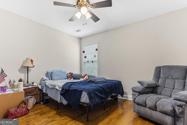 408 Dixieland Dr, Byron, GA 31008 - bedroom with wood finished floors and a ceiling fan