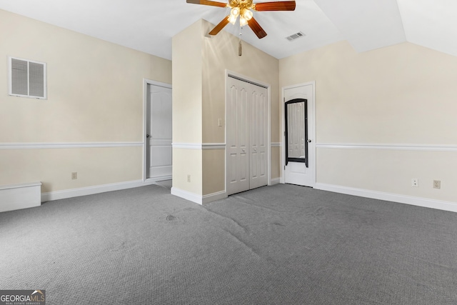 408 Dixieland Dr, Byron, GA 31008 - unfurnished bedroom featuring carpet, multiple closets, ceiling fan, and vaulted ceiling