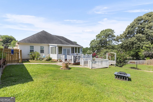 408 Dixieland Dr, Byron, GA 31008 - back of property with a fire pit and a shingled roof