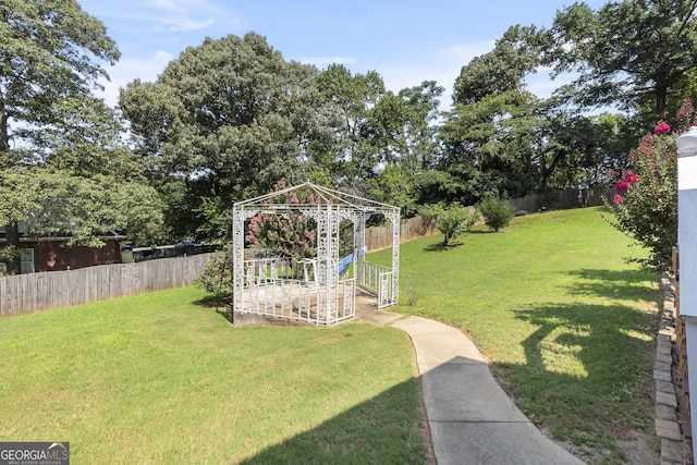 408 Dixieland Dr, Byron, GA 31008 - fenced backyard with a gazebo