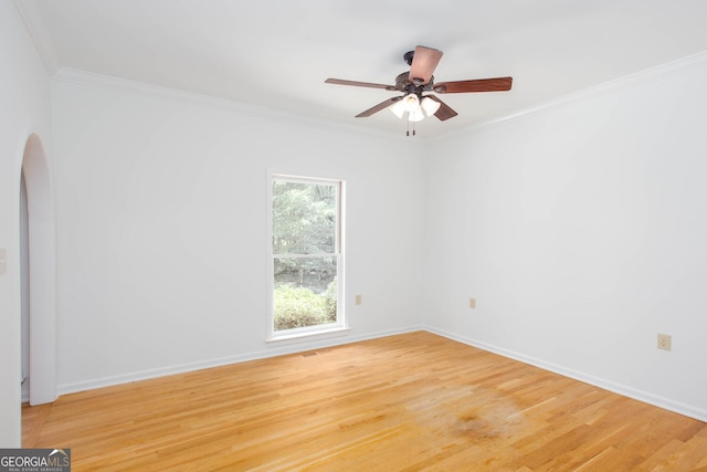 5491 Hiram Rd, Powder Springs, GA 30127 - unfurnished room with arched walkways, light wood-style flooring, crown molding, and a ceiling fan