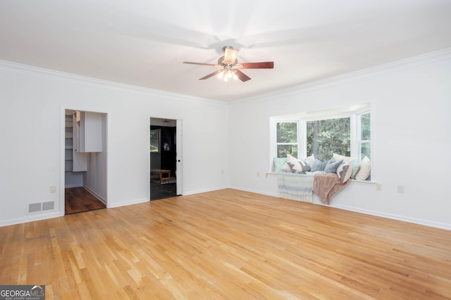 5491 Hiram Rd, Powder Springs, GA 30127 - empty room with a ceiling fan, light wood-style flooring, and crown molding
