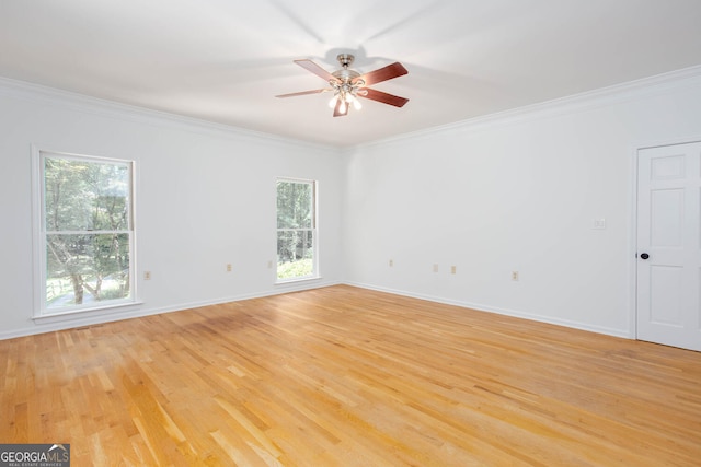 5491 Hiram Rd, Powder Springs, GA 30127 - spare room featuring ornamental molding, a ceiling fan, and light wood-type flooring