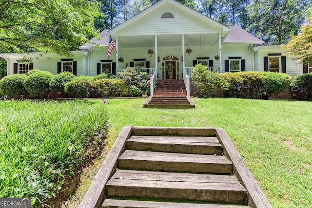 5491 Hiram Rd, Powder Springs, GA 30127 - view of front of home with a front yard, a porch, a shingled roof, and stairs