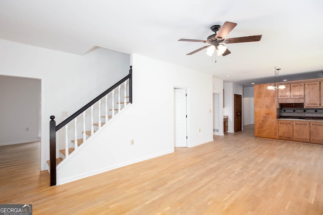 5491 Hiram Rd, Powder Springs, GA 30127 - unfurnished living room with light wood-style flooring, stairway, and a ceiling fan