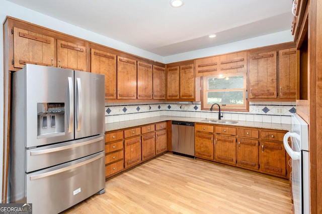 5491 Hiram Rd, Powder Springs, GA 30127 - kitchen with stainless steel appliances, brown cabinetry, decorative backsplash, and recessed lighting