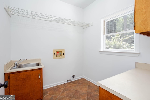 5491 Hiram Rd, Powder Springs, GA 30127 - laundry area with washer hookup, cabinet space, and plenty of natural light