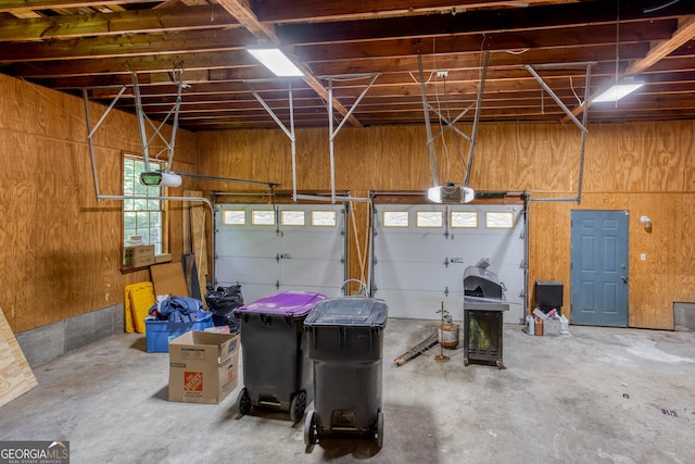 5491 Hiram Rd, Powder Springs, GA 30127 - garage with a garage door opener and wooden walls